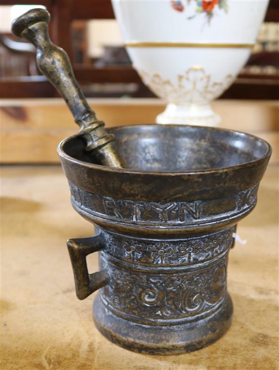 Bronze mortar, dated 1673 and pestle